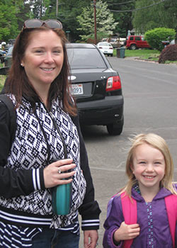 A mother and daughter walk to school together as part of the Safe Routes to School program