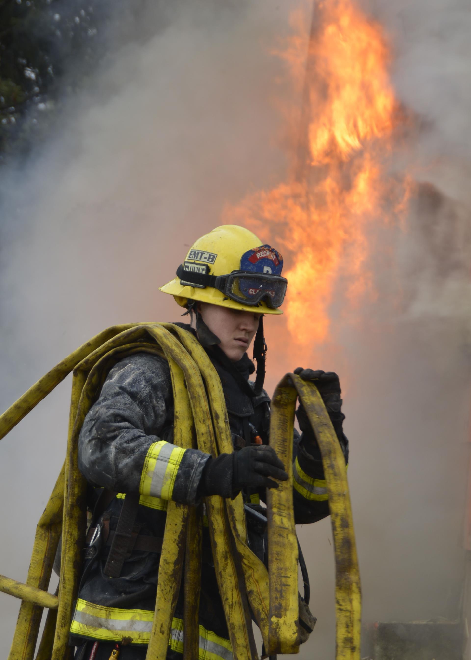 Firefighter Loading Hose