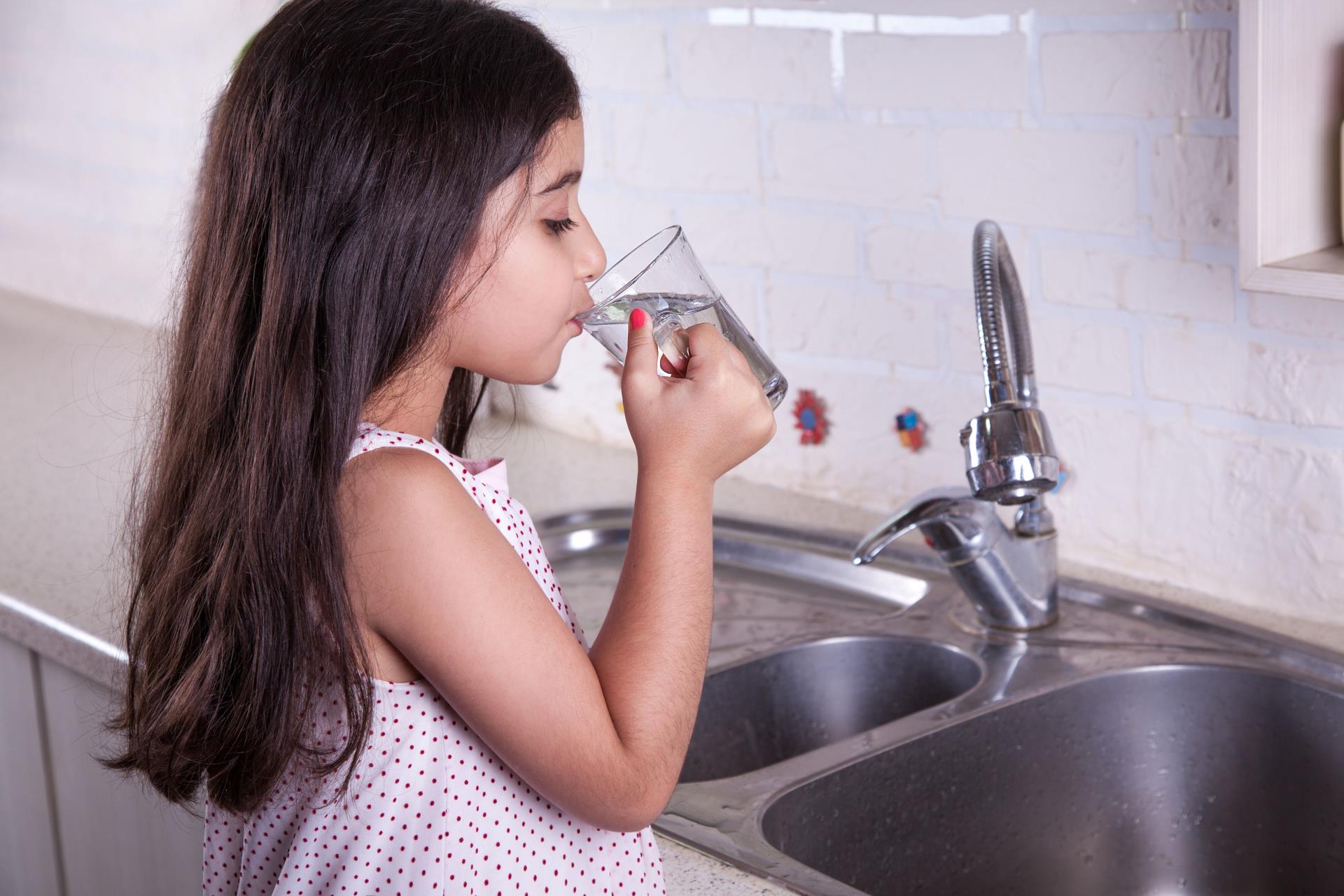 Girl drinking from glass