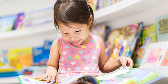 Asian Little Girl with Book