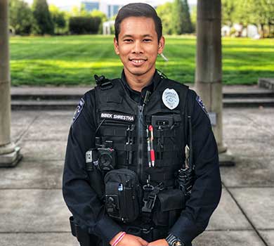 Officer Bibek Shrestha poses in uniform