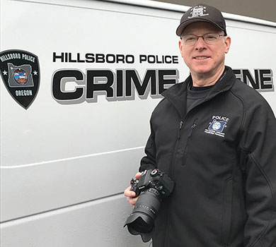 Volunteer Joel Wilson poses with his camera