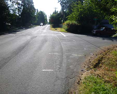 Intersection of Southeast Cedar Street and 40th Court before improvements. No shoulder and no sidewalk are available