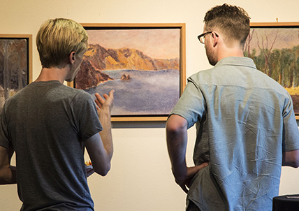 Patrons looking at landscape in the Walter Gallery