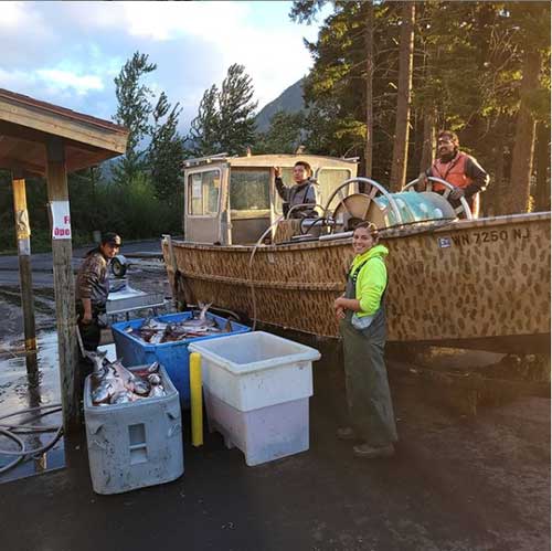 Owners of Tutilla True Fish returning with their boat and catch