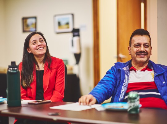 Two community members at a meeting