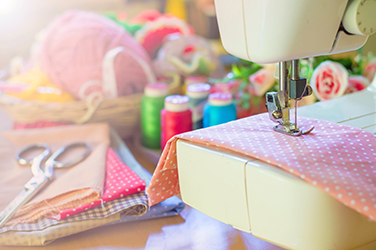 Sewing machine with sewing supplies.