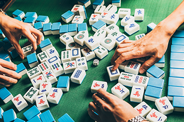 People playing Mahjong.