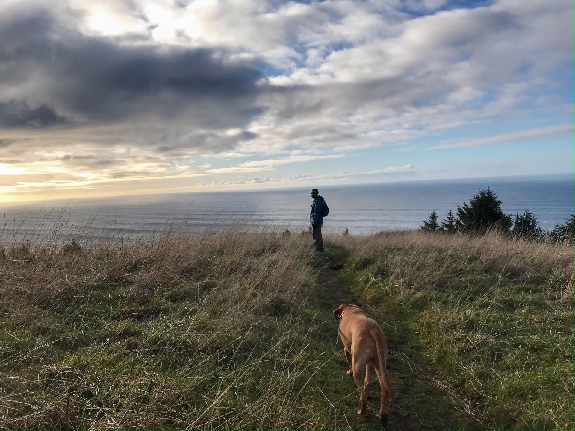 Hariji and dog over looking the coast