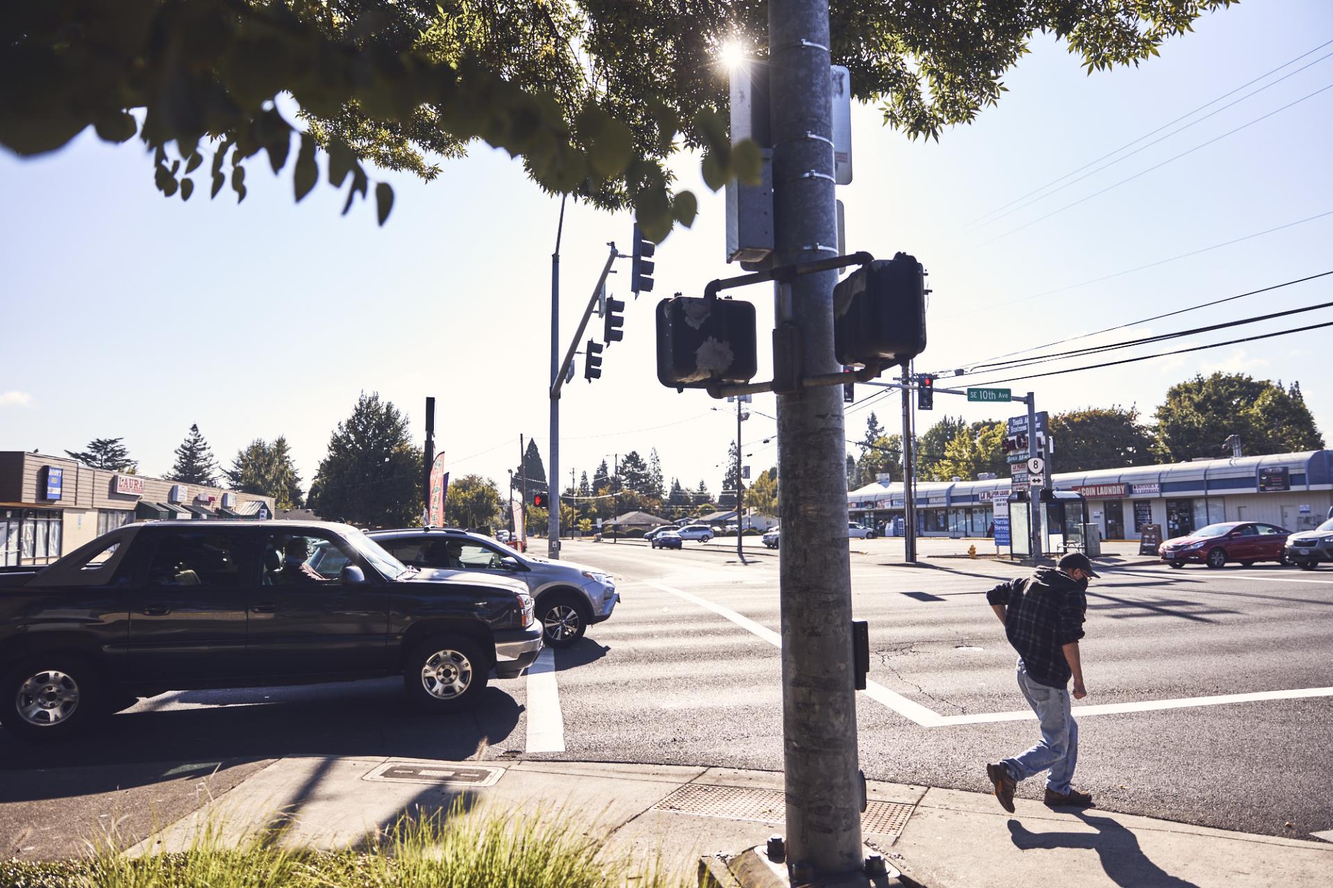 Person crossing a busy street