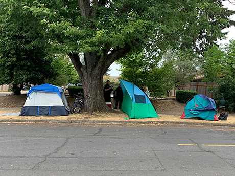 Tents on public right of way between sidewalk and curb