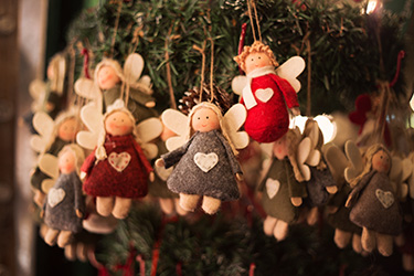 Handmade angels at a holiday bazaar.