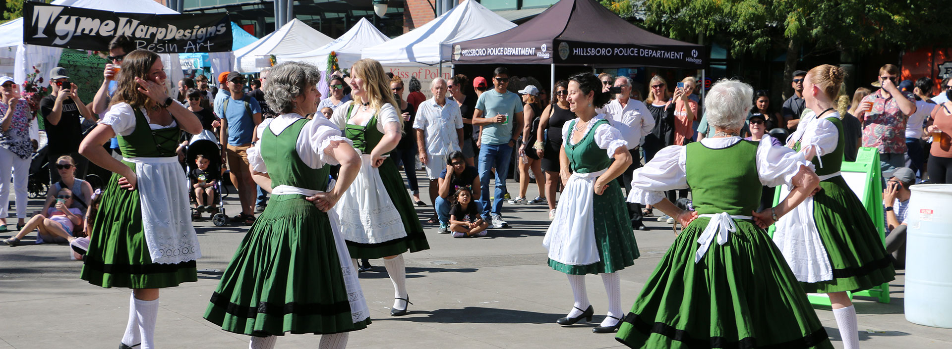 Ladies dance in traditional German dresses at OrenKoFest