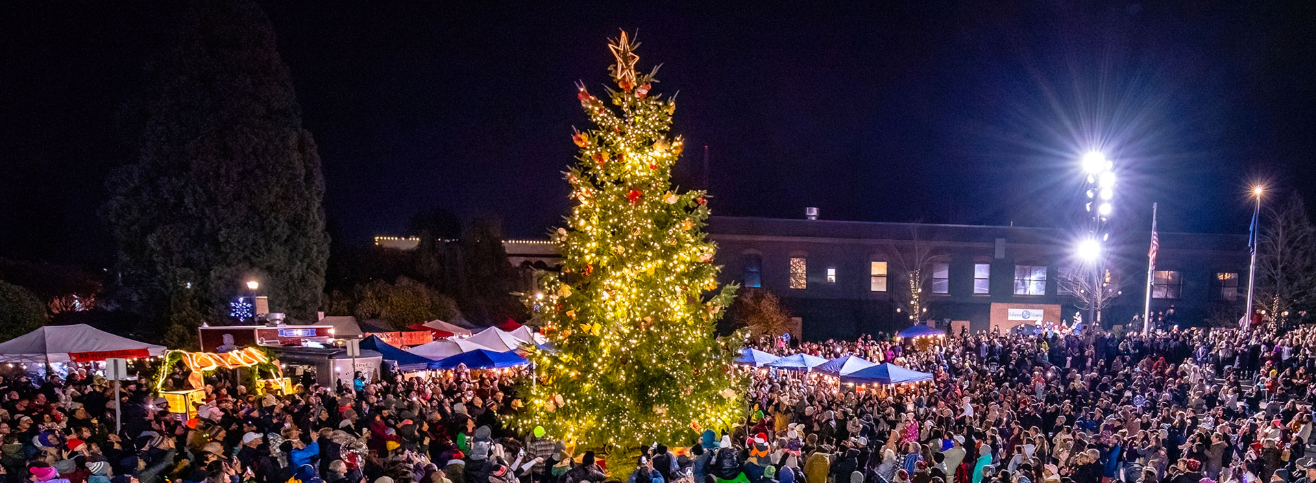 A large crowd gathers for the tree lighting at the Holly Days celebration in Downton Hillsboro