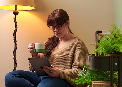 Woman Reading a Tablet