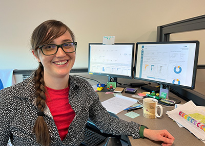 Data Analyst Jessica Gagnon working at her desk