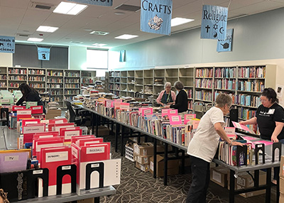 Volunteers setting up the book sale