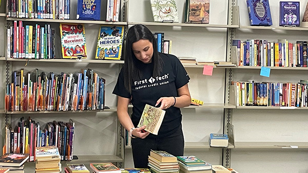 First Tech volunteer setting up the book sale