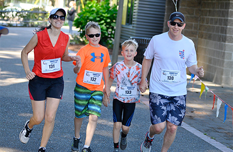 Family running together at SHARC Fest