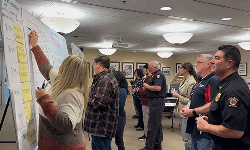 City employees write on display boards at a Strategic Plan engagement event at the Hillsboro Civic Center