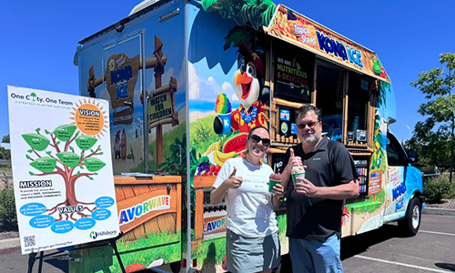 Two Parks & Recreation staff members enjoy Kona Ice in celebration of the launch of the Strategic Plan update