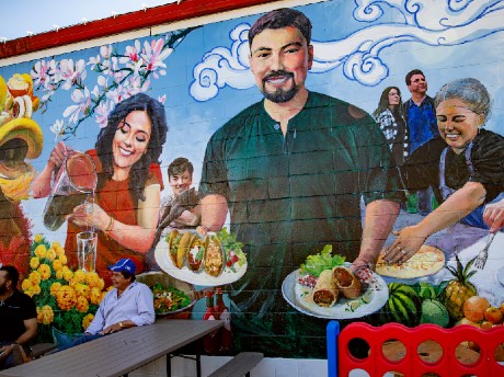 Mural of people making and serving food