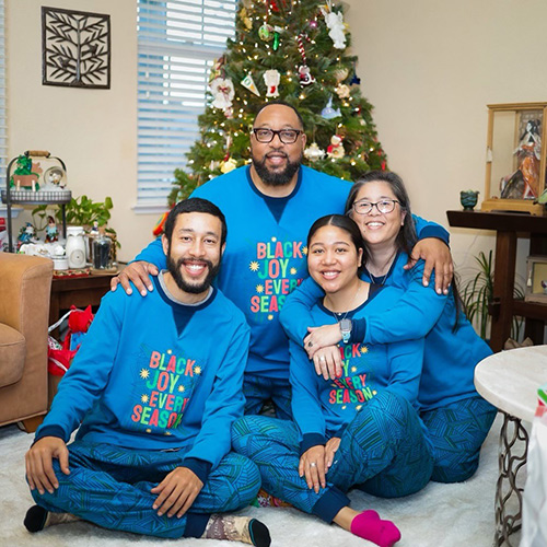 Kiyomi poses with her brother and parents in holiday pijamas