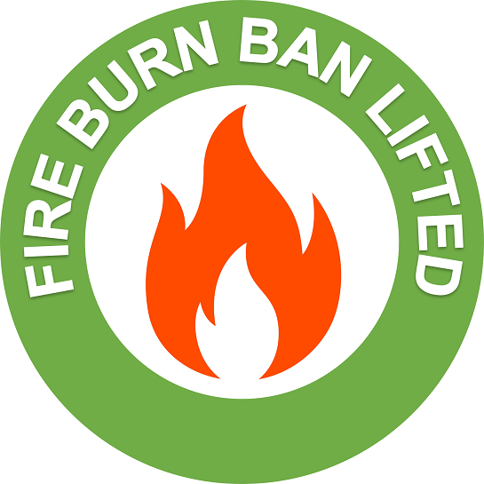 Green circle with an orange flame in the middle and white text in the green circle reading fire burn ban lifted