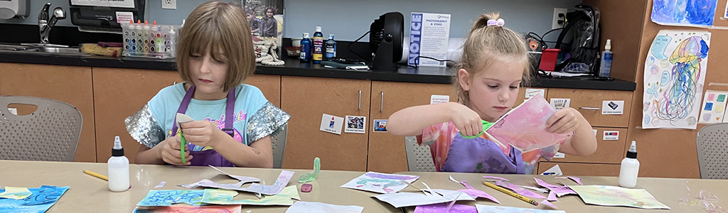 students in a youth painting class