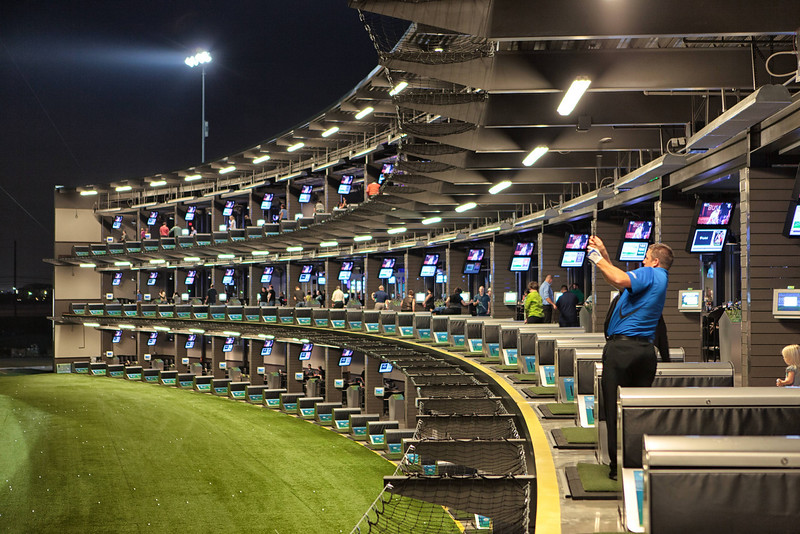 Nighttime Tee Line Golfer at TopGolf