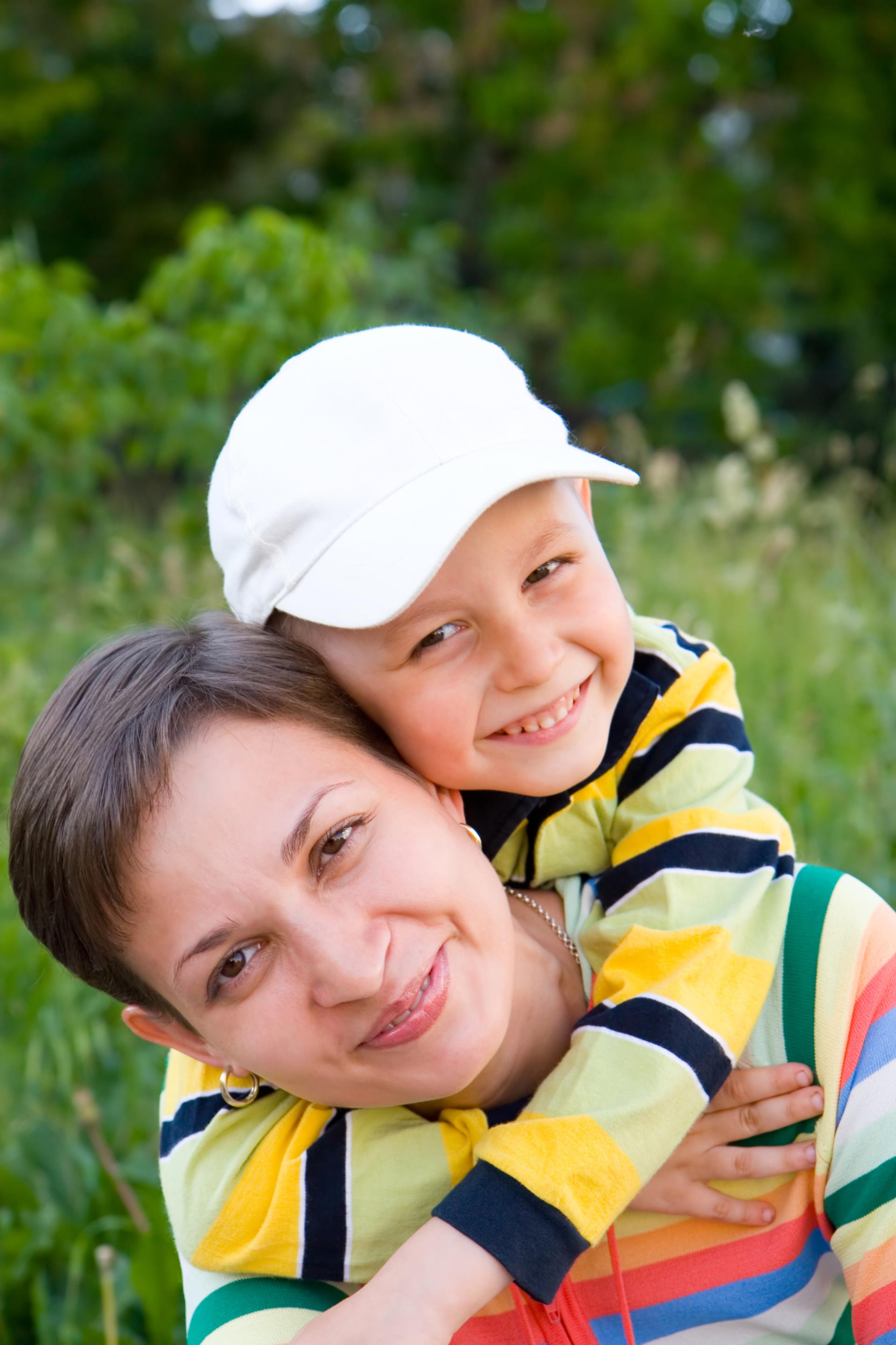 Closeup image of a Mom & Son in a field